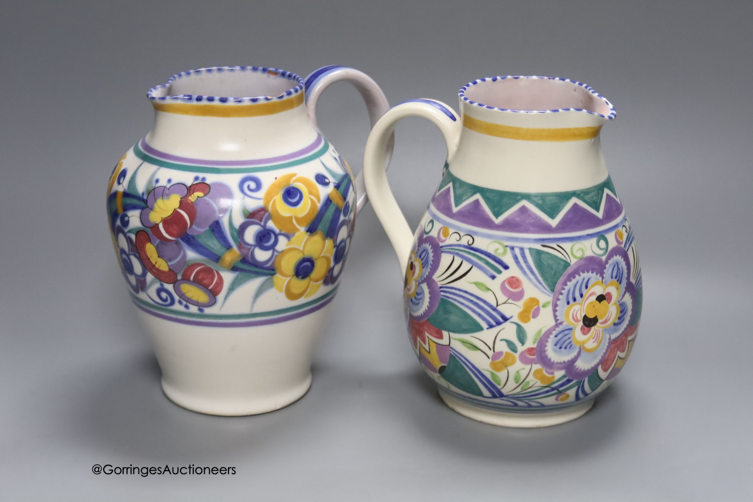 Two Poole pottery jugs, tallest 20.5cm